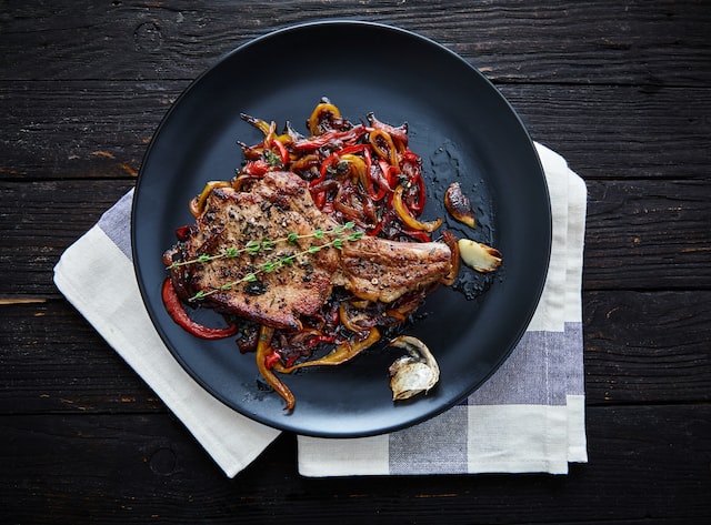 steak with vegetables in a frying pan