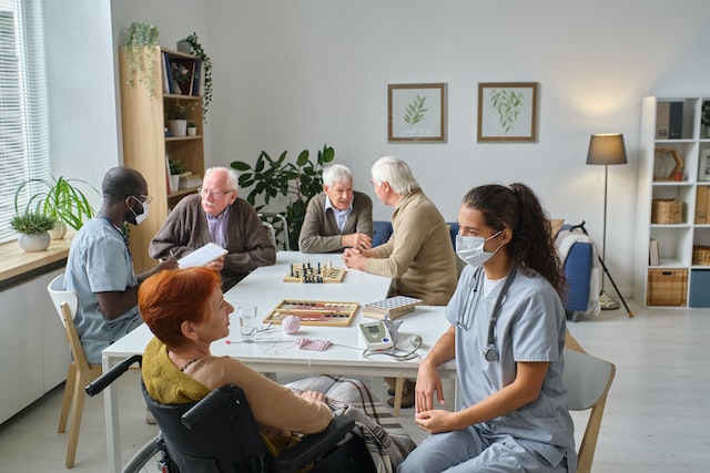 Nurse talking to elderly woman