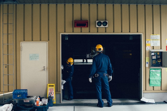 man standing in front of open doorway