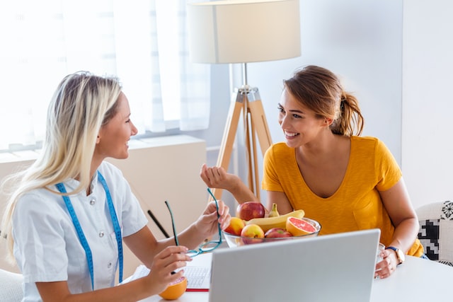 Doctor nutritionist, dietician and female patient on consultation