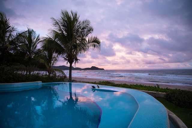 photo of pool and beautiful sea view