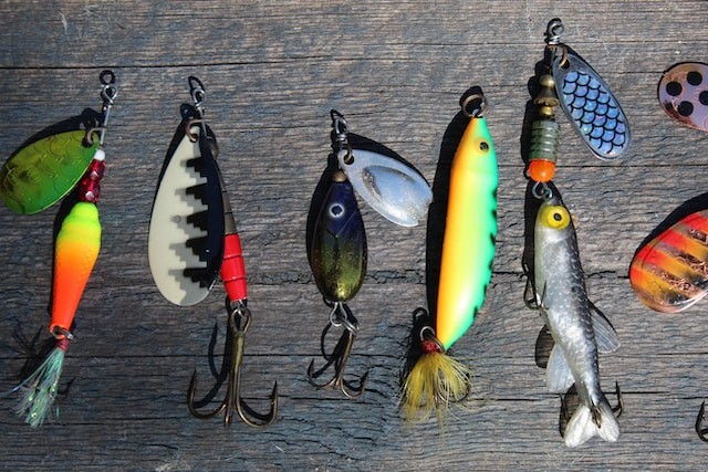 fishing lures on the wooden surface