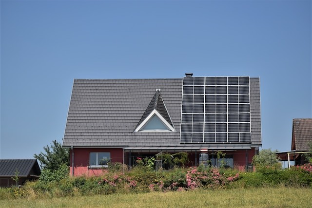 a-house-with-a-solar-panel-on-the-roof