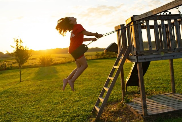 person on the playground with fake grass