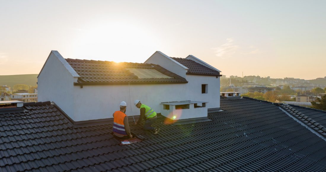 persons working on a roof
