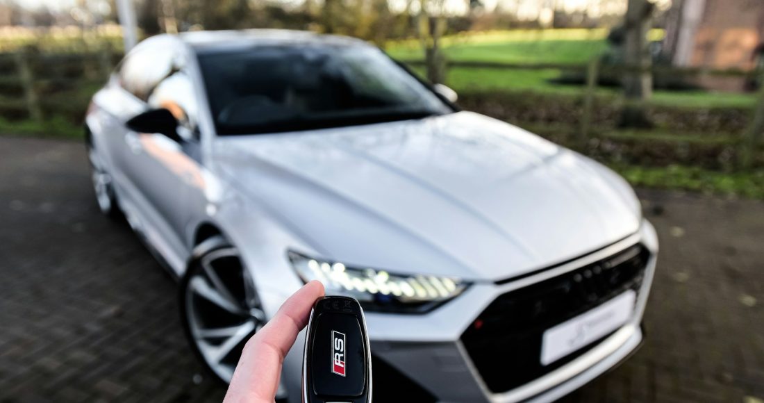 person holding car key