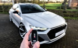 person holding car key