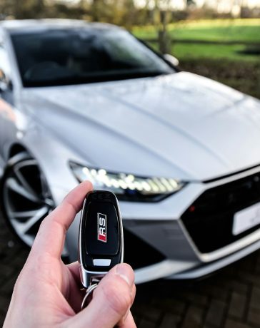 person holding car key