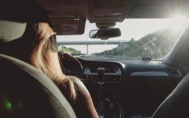 woman-driving-car-on-freeway