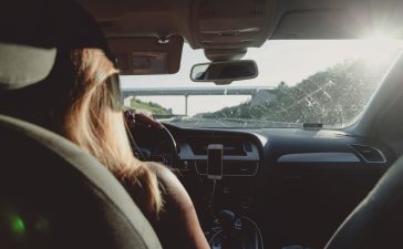 woman-driving-car-on-freeway