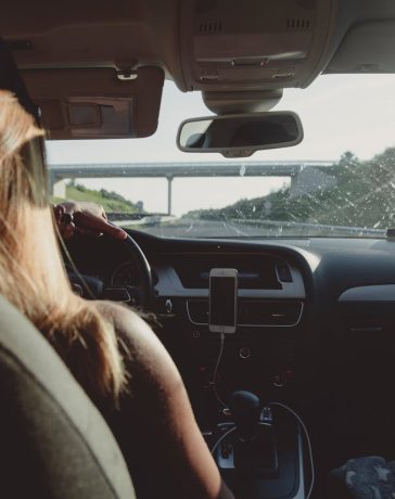 woman-driving-car-on-freeway