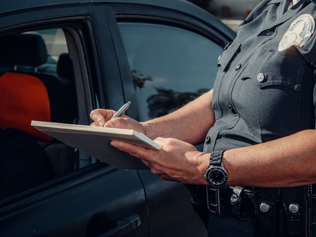 police-officer-writing-on-a-notebook