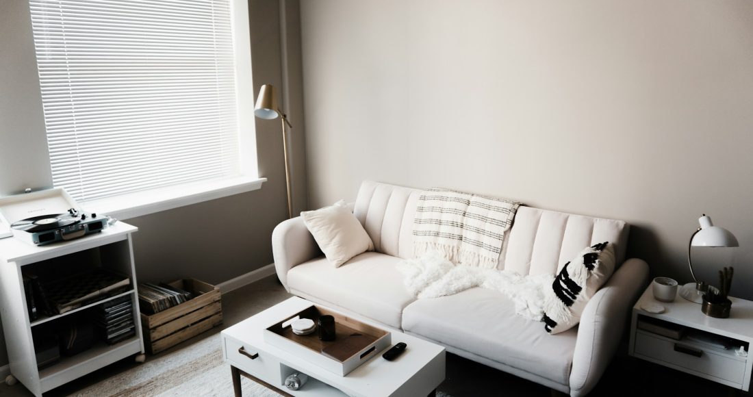 white-couch-in-front-of-white-wooden-table