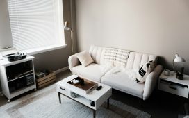 white-couch-in-front-of-white-wooden-table