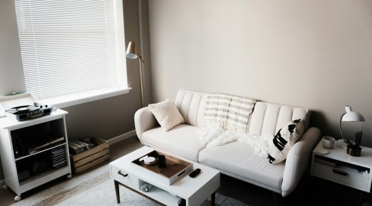 white-couch-in-front-of-white-wooden-table