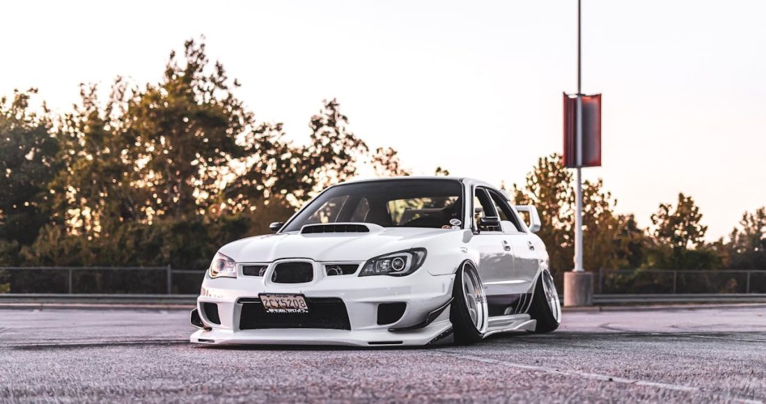 white-vehicle-parked-on-road