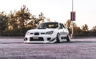 white-vehicle-parked-on-road