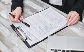a-person-holding-a-black-pen
