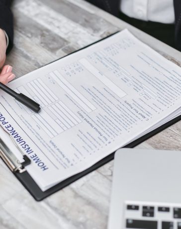 a-person-holding-a-black-pen