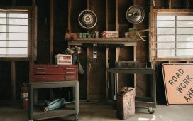 brown-wooden-desk-with-black-and-white-round-fan